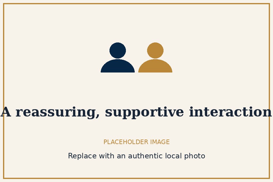 Placeholder image — a reassuring, supportive interaction with an older adult